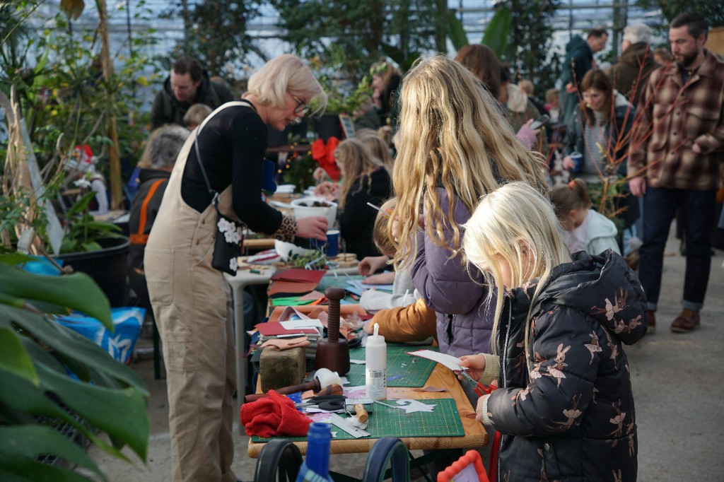 People of different ages learning together in a community workshop